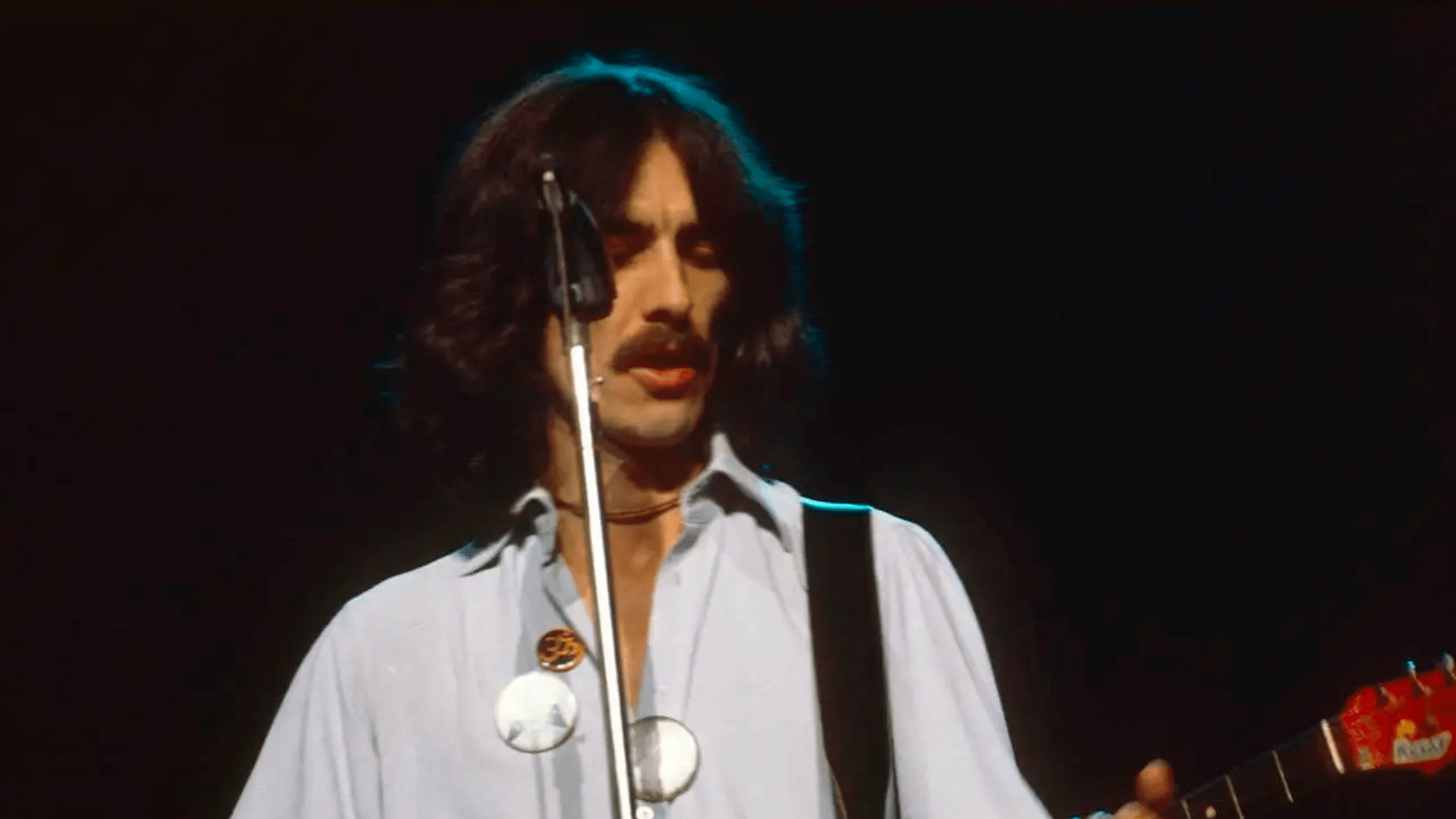 George Harrison souriant sans besoin de tournées