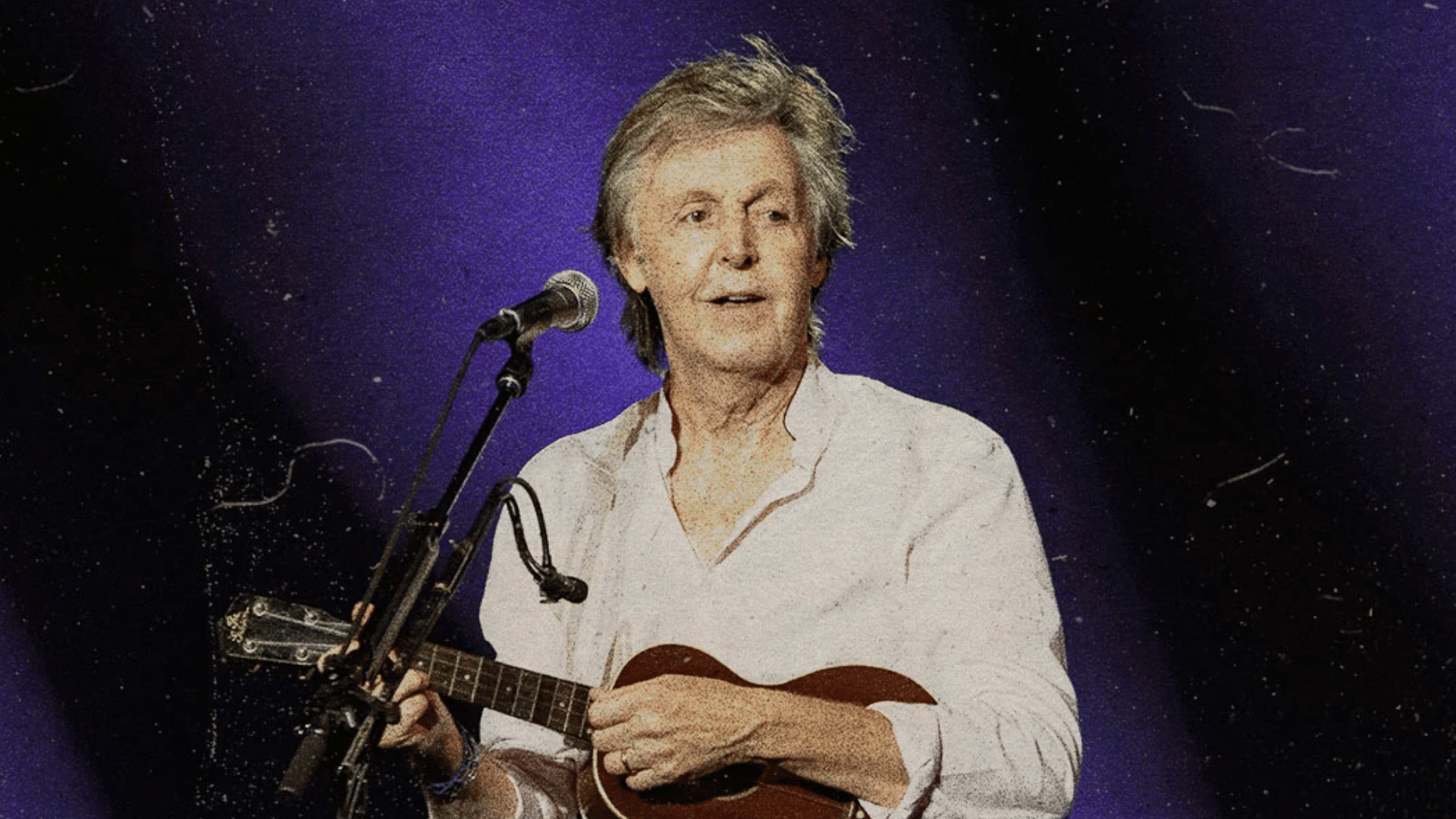Paul McCartney interprétant 'Here Today', un hommage à John Lennon, sur scène.