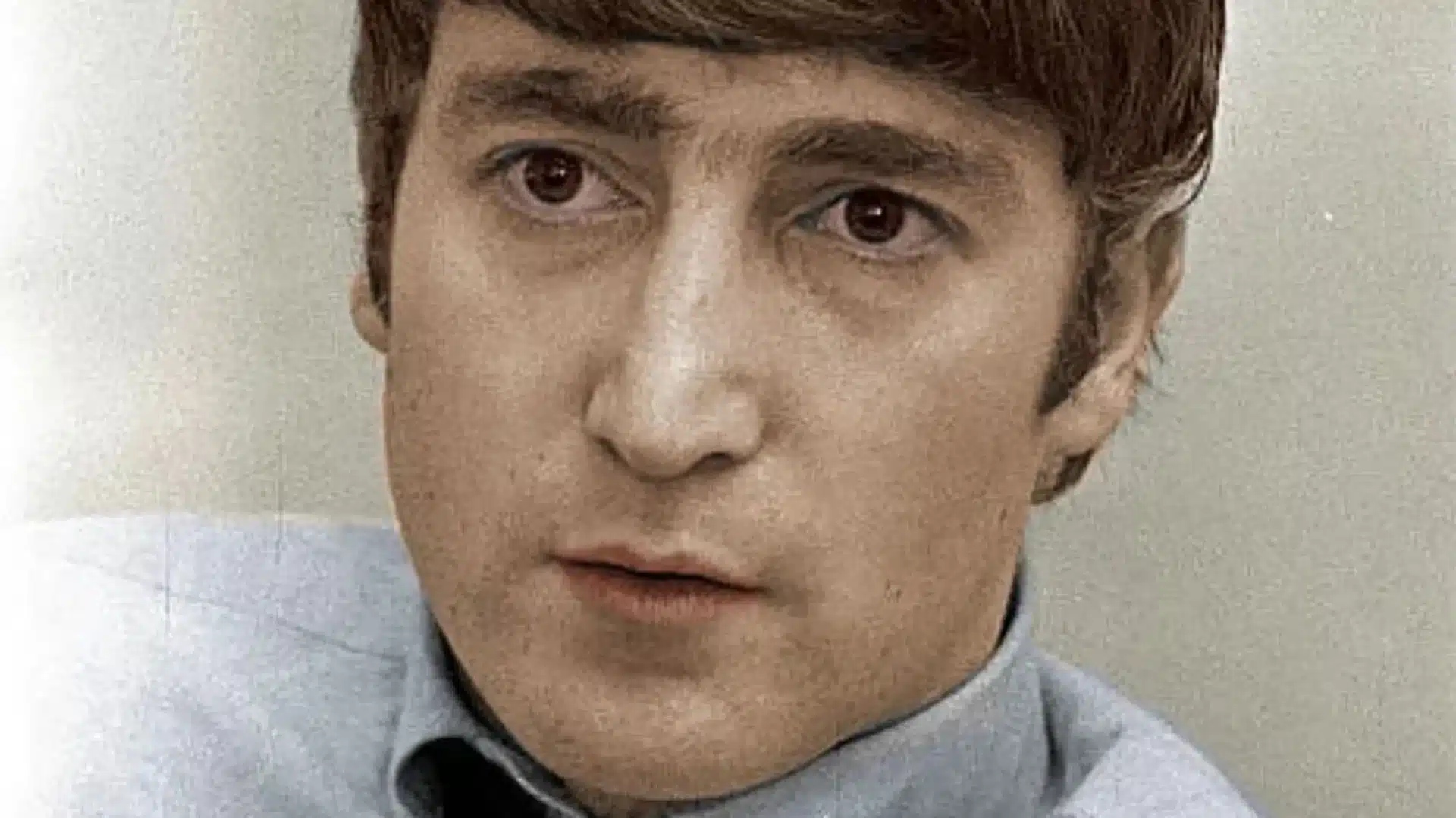 John Lennon et sa guitare Rickenbacker en performance avec les Beatles